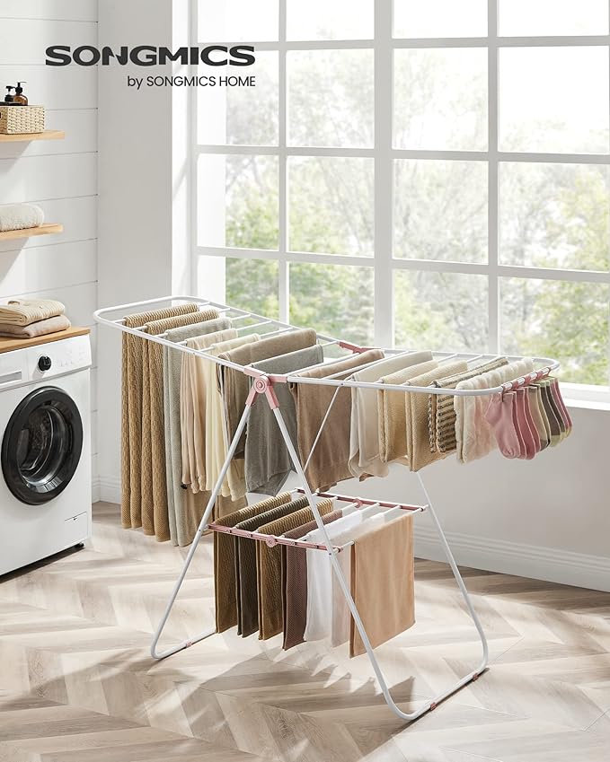 SONGMICS Clothes Drying Rack, with Sock Clips, Metal Laundry Rack, Foldable, Space-Saving, Free-Standing Airer, with 2 Height-Adjustable Gullwings, Indoor Outdoor Use, White and Pink ULLR052P01